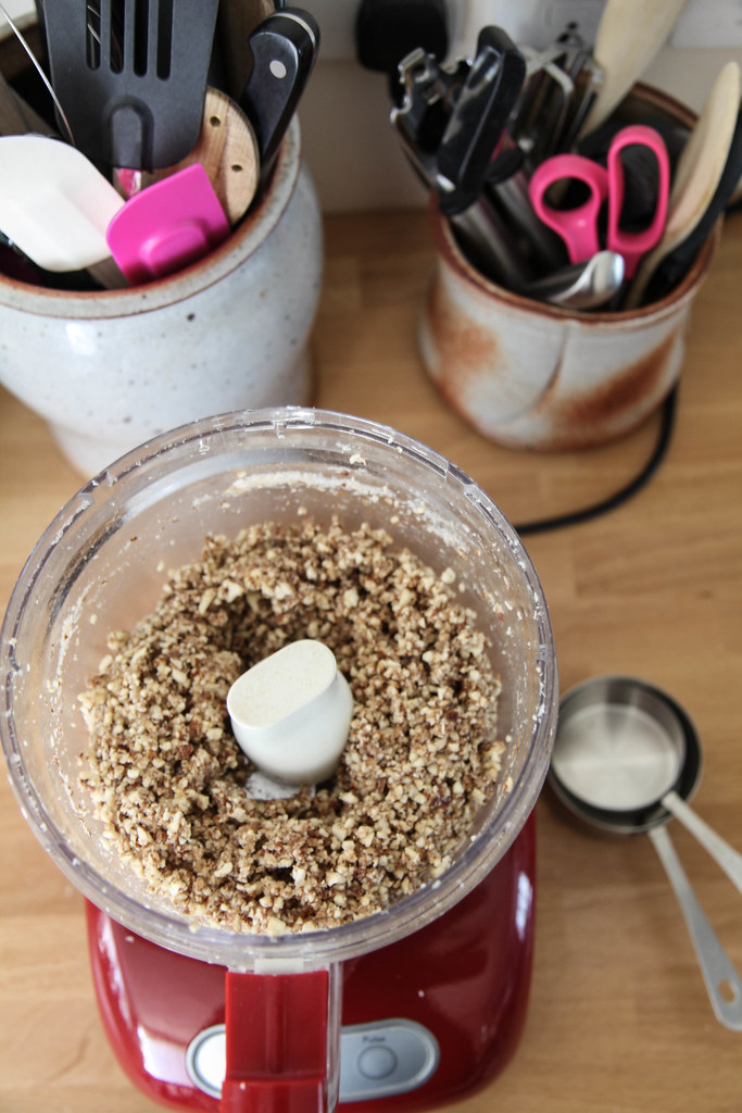 Blending the almond crust in the food processor